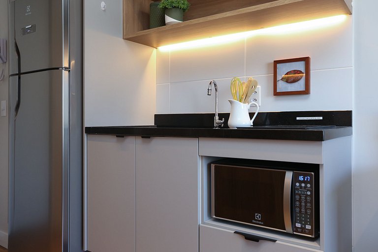 Studio Charmoso com Piscina Rooftop